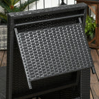 Black woven outdoor table with a plant in the background