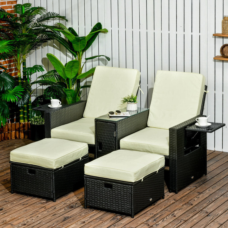 Outdoor patio furniture set with chairs, ottomans, and a small table on a wooden deck.
