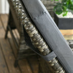 Gray cushion with woven pattern on a chair outdoors