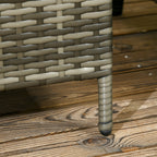 Close-up of a woven chair leg on a wooden deck