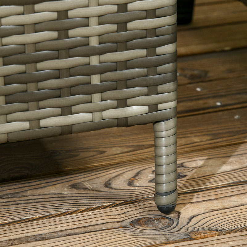 Close-up of a woven chair leg on a wooden deck