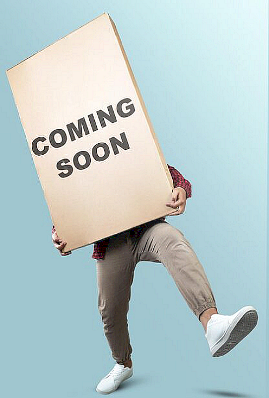 Person holding a 'COMING SOON' sign against a light blue background