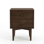 A dark brown wooden two-drawer nightstand with tapered legs and round metal knobs, photographed against a clean white background.