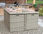 Royalcraft Wentworth cube dining set on patterned rug with garden plants