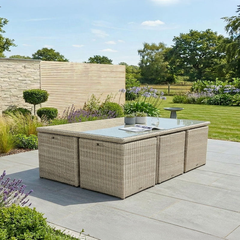Royalcraft Wentworth 10 seater cube dining set on patio with garden background